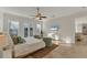 Bright bedroom with king-size bed, sitting area, and water views at 634 Key Royale Dr, Holmes Beach, FL 34217