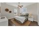 Light and airy bedroom with a queen bed, nightstands, and a view at 634 Key Royale Dr, Holmes Beach, FL 34217