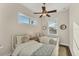 Charming bedroom with twin beds, and hardwood floors at 634 Key Royale Dr, Holmes Beach, FL 34217