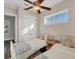 Well lit bedroom with twin beds, and hardwood floors at 634 Key Royale Dr, Holmes Beach, FL 34217