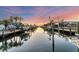 Tranquil waterfront view with boats and sunset at 634 Key Royale Dr, Holmes Beach, FL 34217
