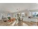 Kitchen and dining area with an open floor plan and lots of natural light at 634 Key Royale Dr, Holmes Beach, FL 34217