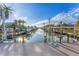 Private dock with boat lift and access to the waterway at 634 Key Royale Dr, Holmes Beach, FL 34217