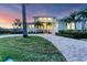 Two-story waterfront home with a large driveway at 634 Key Royale Dr, Holmes Beach, FL 34217