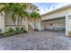 Spacious garage with paver driveway and boat storage at 634 Key Royale Dr, Holmes Beach, FL 34217