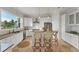 Modern kitchen with island and granite countertops at 634 Key Royale Dr, Holmes Beach, FL 34217