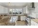 Modern kitchen with granite countertops and stainless steel appliances at 634 Key Royale Dr, Holmes Beach, FL 34217