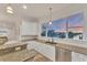 Kitchen with granite counters and waterfront view at 634 Key Royale Dr, Holmes Beach, FL 34217