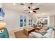 Bright living room with water views and comfy seating at 634 Key Royale Dr, Holmes Beach, FL 34217