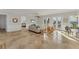 Bright living room with tile floors, comfy seating, and access to a balcony at 634 Key Royale Dr, Holmes Beach, FL 34217