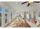 Bright living room with comfy seating and access to a patio at 634 Key Royale Dr, Holmes Beach, FL 34217