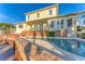 Inviting pool area with brick patio and spacious deck at 634 Key Royale Dr, Holmes Beach, FL 34217