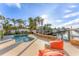 Freeform pool with canal views and comfortable seating at 634 Key Royale Dr, Holmes Beach, FL 34217