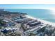 Aerial view of beachfront property, coastal town, and ocean at 6424 Midnight Pass Rd # 12A, Sarasota, FL 34242