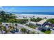 Aerial view of beach, parking, and beachfront building at 6424 Midnight Pass Rd # 12A, Sarasota, FL 34242