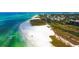 Beachfront property with white sand and turquoise water at 6424 Midnight Pass Rd # 12A, Sarasota, FL 34242