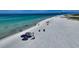 Aerial view of a tranquil beach with clear water at 6424 Midnight Pass Rd # 12A, Sarasota, FL 34242