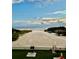 Beach view from condo, showing beach access and amenities at 6424 Midnight Pass Rd # 12A, Sarasota, FL 34242