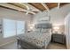 King bed, coastal decor, and a large window in this bright bedroom at 6424 Midnight Pass Rd # 12A, Sarasota, FL 34242