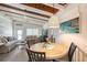 Round dining table with four chairs in open concept space at 6424 Midnight Pass Rd # 12A, Sarasota, FL 34242