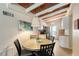 Kitchen and dining area with wood ceilings and round table at 6424 Midnight Pass Rd # 12A, Sarasota, FL 34242