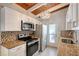 Modern kitchen with stainless steel appliances and granite at 6424 Midnight Pass Rd # 12A, Sarasota, FL 34242