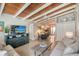 Open concept living space with wood ceilings and kitchen view at 6424 Midnight Pass Rd # 12A, Sarasota, FL 34242