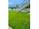 Artificial turf patio with stairs and picnic tables at 6424 Midnight Pass Rd # 12A, Sarasota, FL 34242