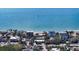Aerial view of a beachfront home with ocean access at 6501 Gulf Of Mexico Dr, Longboat Key, FL 34228