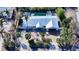 Aerial view of a single-story home with a pool and tropical landscaping at 6501 Gulf Of Mexico Dr, Longboat Key, FL 34228