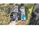 Aerial view of house with pool, patio, and large backyard, located on a lake at 6706 88Th E St, Bradenton, FL 34202