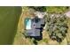 Aerial view of a lakefront house featuring a backyard pool at 6706 88Th E St, Bradenton, FL 34202