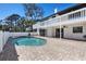 Backyard pool and patio area with outdoor ceiling fans and a privacy fence at 6706 88Th E St, Bradenton, FL 34202