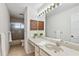 Clean bathroom, featuring a vanity with sink, shower, and toilet at 6706 88Th E St, Bradenton, FL 34202