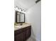 Clean bathroom with dark vanity and updated lighting at 6706 88Th E St, Bradenton, FL 34202