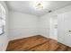 Simple bedroom with wood floors and access to kitchen at 6706 88Th E St, Bradenton, FL 34202