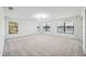 Spacious bedroom with large windows overlooking a lake at 6706 88Th E St, Bradenton, FL 34202
