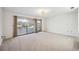 Bedroom with water view and sliding glass doors to balcony at 6706 88Th E St, Bradenton, FL 34202