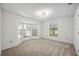 Bright bedroom with bay windows and wall-to-wall carpeting at 6706 88Th E St, Bradenton, FL 34202