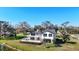 Exterior view of a two-story home with a balcony overlooking the landscaped yard at 6706 88Th E St, Bradenton, FL 34202