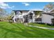 Two-story house with white exterior, dark gray accents, and a manicured lawn at 6706 88Th E St, Bradenton, FL 34202