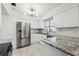 Modern kitchen with stainless steel appliances and granite countertops at 6706 88Th E St, Bradenton, FL 34202