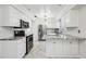 Updated kitchen boasts stainless steel appliances and granite countertops at 6706 88Th E St, Bradenton, FL 34202
