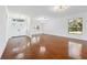 Spacious living room with hardwood floors and large windows at 6706 88Th E St, Bradenton, FL 34202