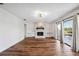 Spacious living room with hardwood floors, fireplace and patio access at 6706 88Th E St, Bradenton, FL 34202