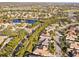 Aerial view of a neighborhood near a golf course and pond at 6815 Turnberry Isle Ct, Lakewood Ranch, FL 34202