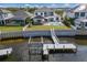 Beautiful waterfront home with a private dock, outdoor pool, and lush landscaping at 696 Regatta Way, Bradenton, FL 34208