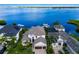 Waterfront home with lush landscaping and boat dock at 696 Regatta Way, Bradenton, FL 34208