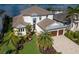 Luxurious home showcasing a beautiful lawn and landscaping in a desirable location at 696 Regatta Way, Bradenton, FL 34208