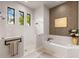 Relaxing bathroom featuring a soaking tub, walk-in shower, and stylish decor at 696 Regatta Way, Bradenton, FL 34208